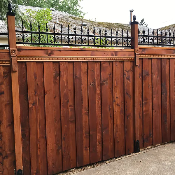 Cedar fence with steel top rail