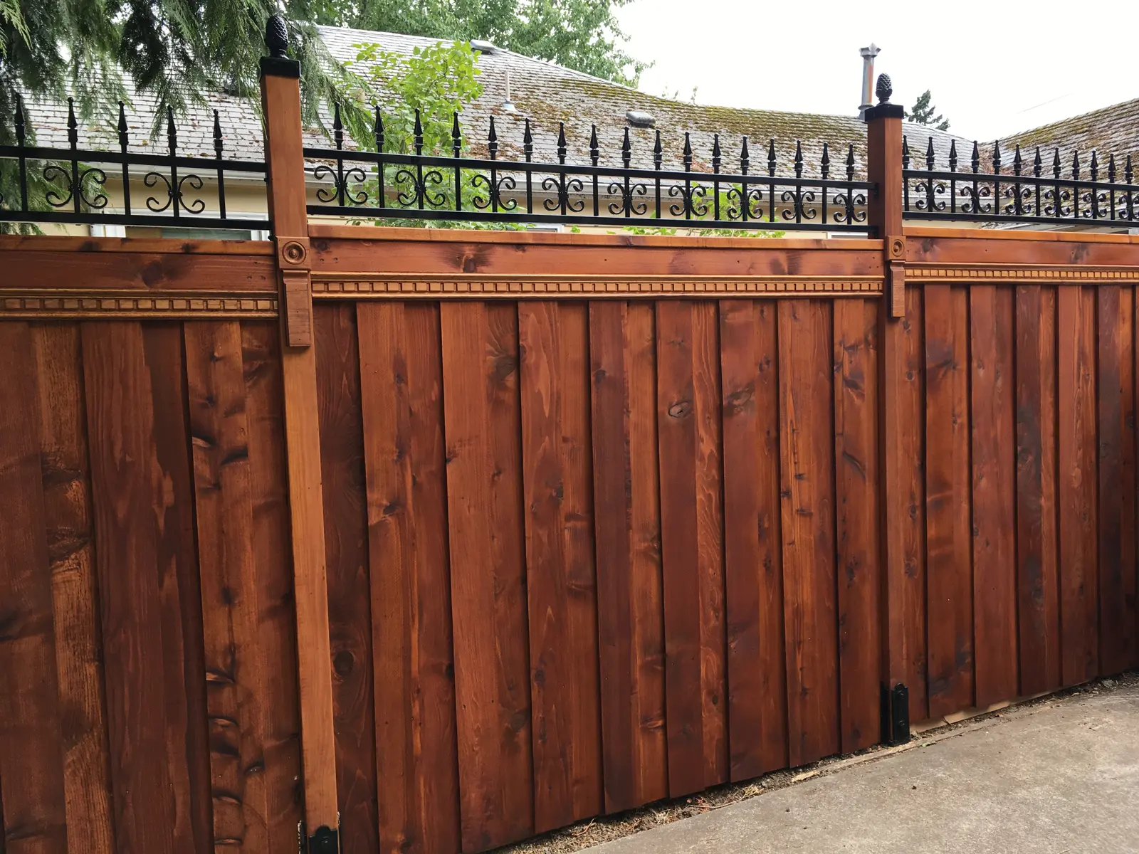 Cedar fence with steel top rail