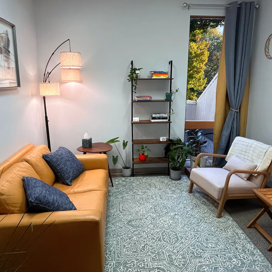 Shane's therapy office with a couch and armchair